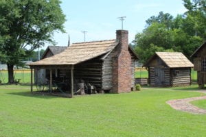 Photo of one of the log cabin buildings at the Cowan Museum.
