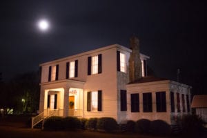 Photo of the right front side of the Cowan Museum at night.