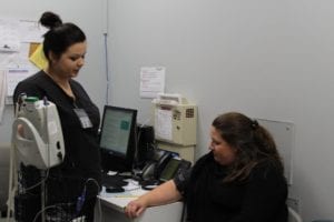 Photo of checking the blood pressure at the County Health Department.