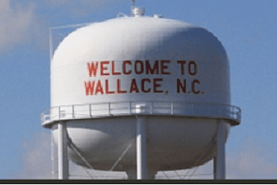Photo of a county water tower with Welcome to Wallace N.C.